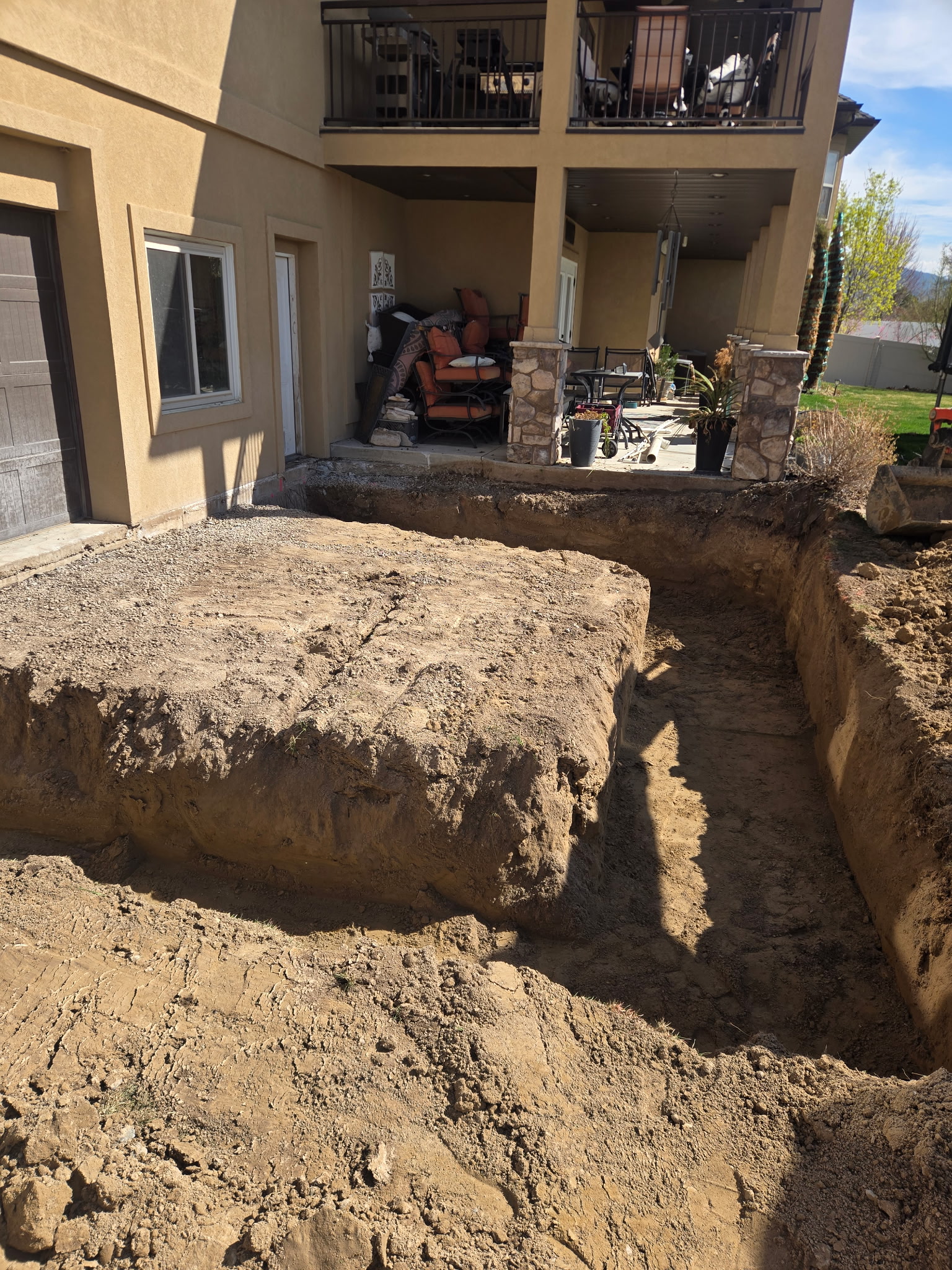 Large excavation next to residential home